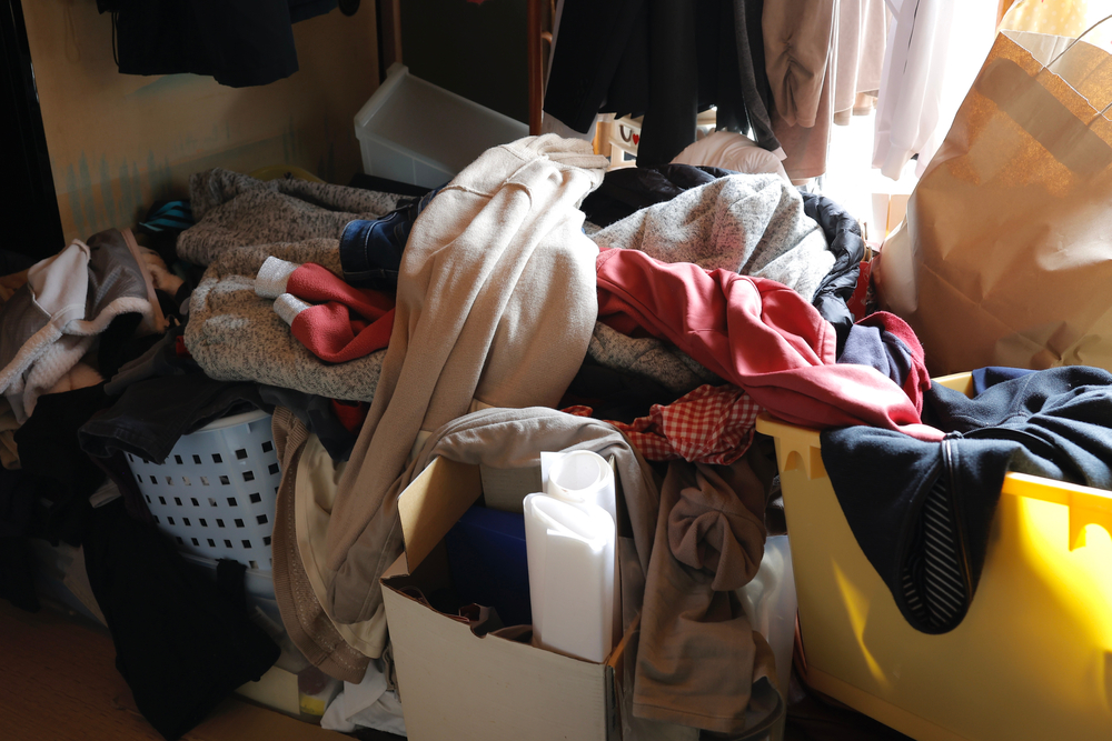 Hoarded room filled with clothing and belongings