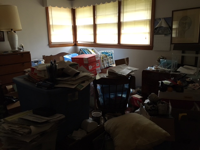Bedroom filled floor to ceiling before cleanup