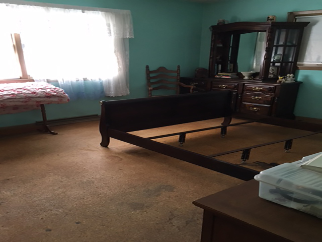 Bedroom safe and clear after hoarding cleanup